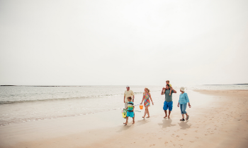 Family walking along the beach