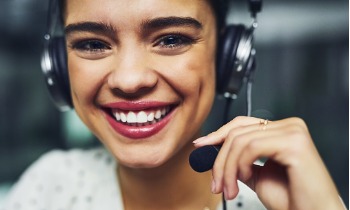 Friendly Carolina Trust customer service rep smiling and wearing a headset